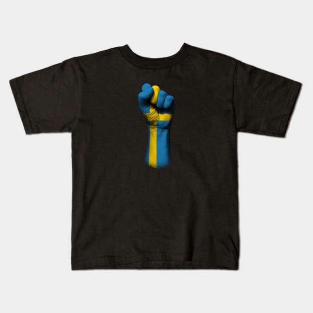 Flag of Sweden on a Raised Clenched Fist Kids T-Shirt by jeffbartels